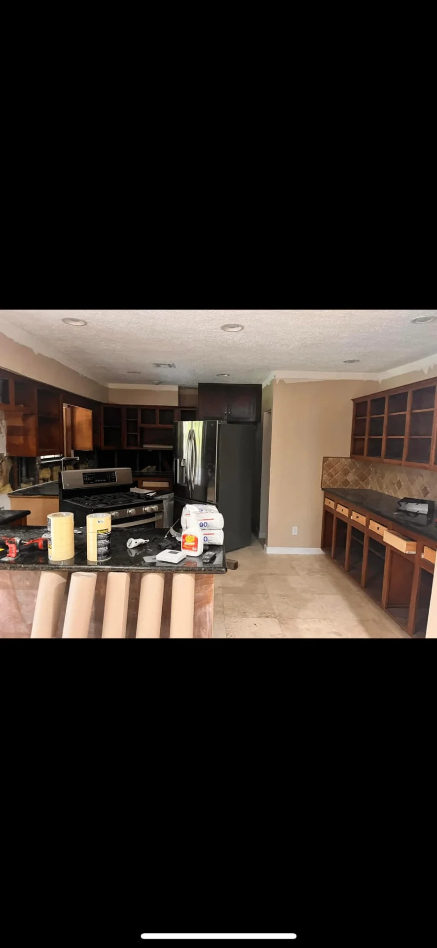 Kitchen before remodel showing outdated layout and finishes